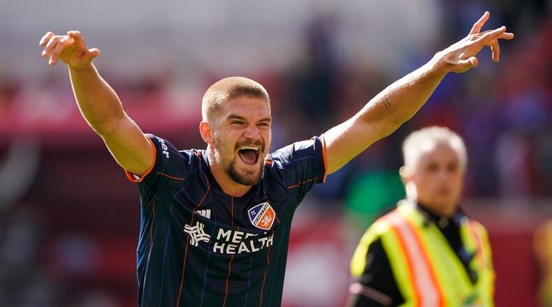 FC Cincinnati defender Nick Hagglund celebrates after defeating the New York Red Bulls during an MLS soccer playoff match, Saturday, October 15, 2022, in Harrison, N.J. FC Cincinnati won 2-1.(AP Photo/Eduardo Munoz Alvarez)