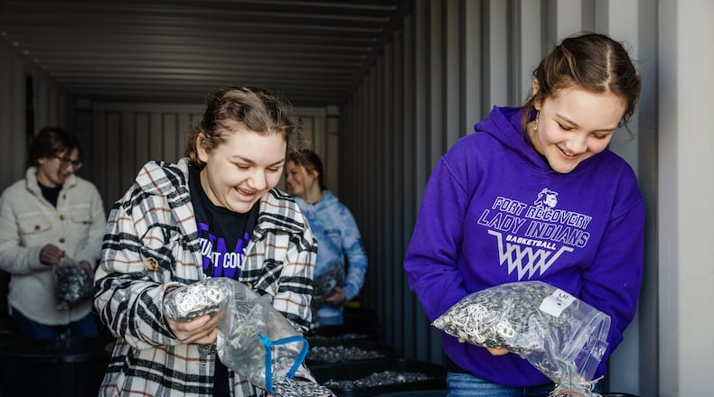 Fort Recovery High School Student Council members donate their pop tabs to the Ronald McDonald House Charities. CONTRIBUTION
