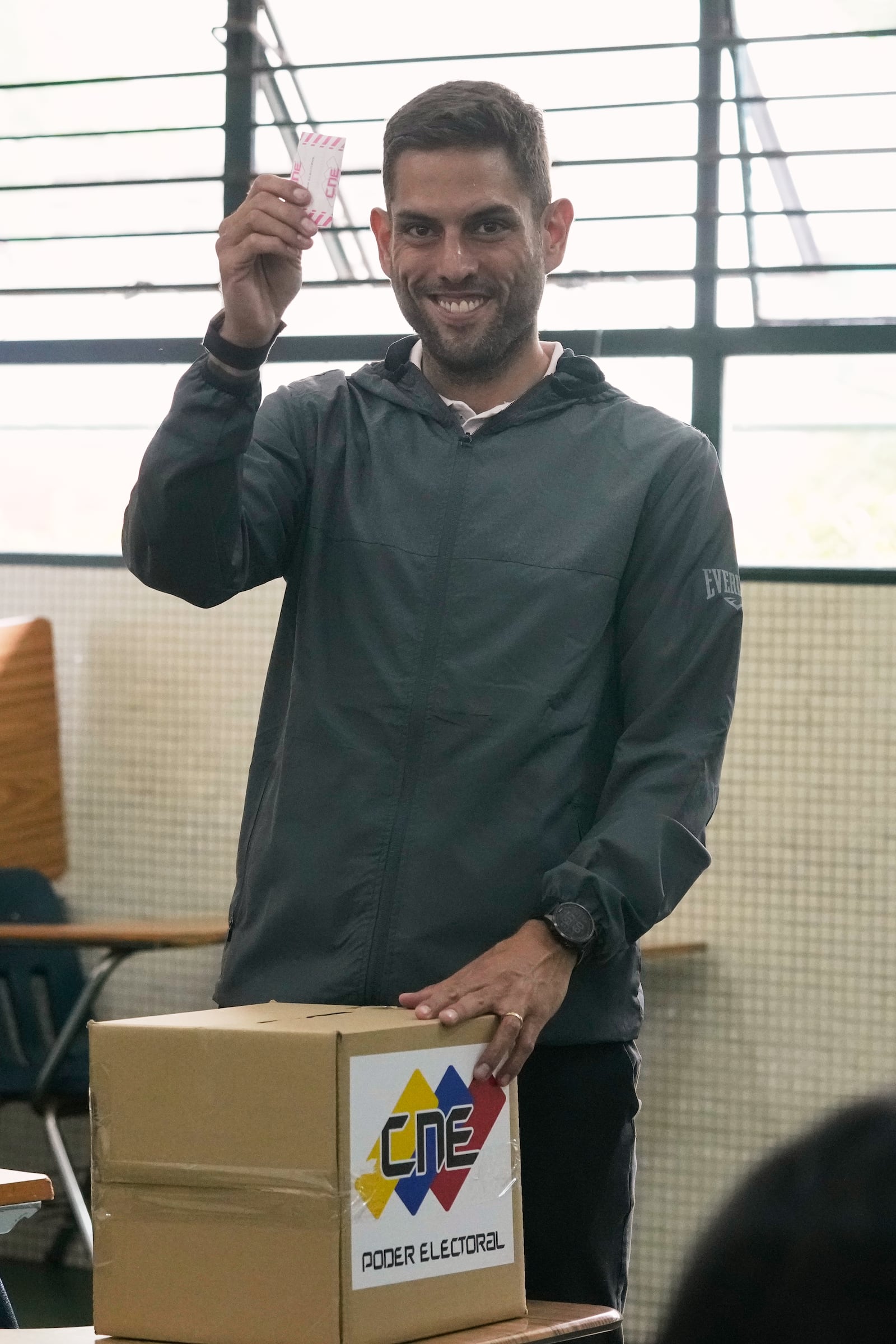 Juan Requesens, former opposition lawmaker and candidate for governor of Miranda state, votes in legislative and local elections in Caracas, Venezuela, Sunday, May 25, 2025. (AP Photo/Ariana Cubillos)