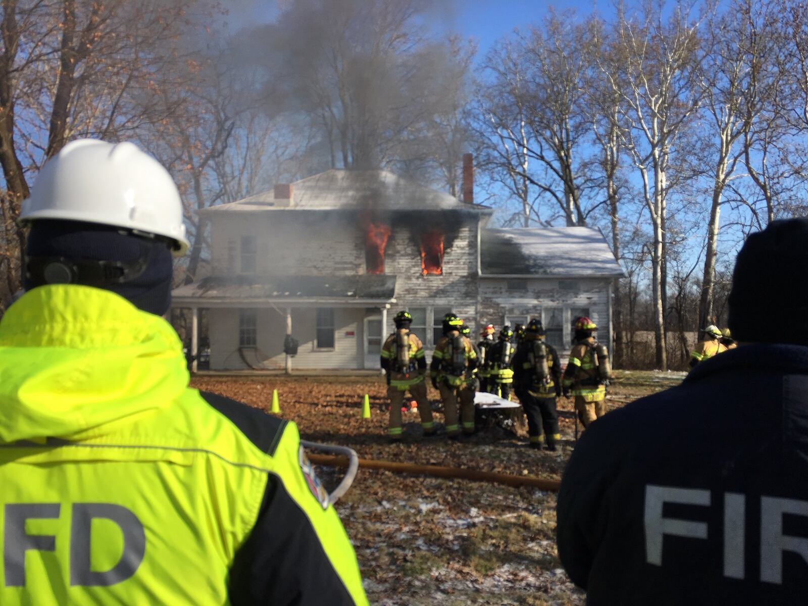 UL Firefighter Safety Research Institute and the Illinois Fire Service Institute conducted research during live fires at abandoned homes this week at homes in Beavercreek Twp. RICHARD WILSON/STAFF