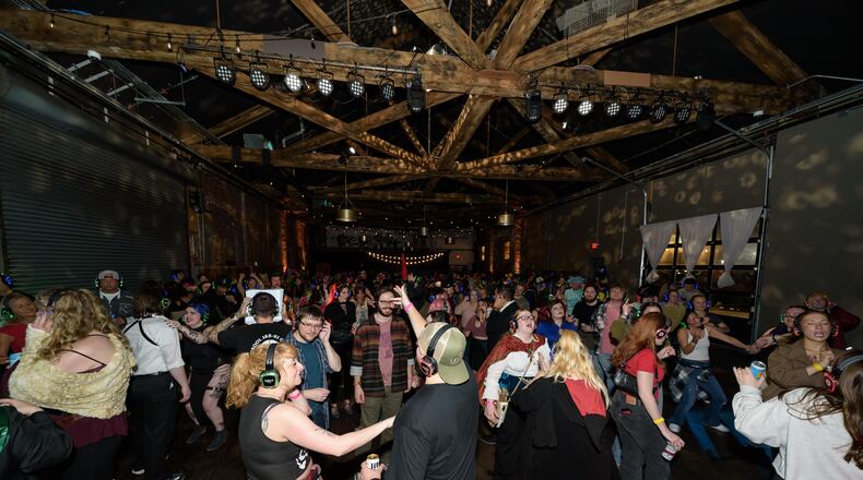 Dayton Silent Disco celebrates four years of dance parties April 18 at The Brightside Music & Event Venue in downtown Dayton. TOM GILLIAM / CONTRIBUTING PHOTOGRAPHER
