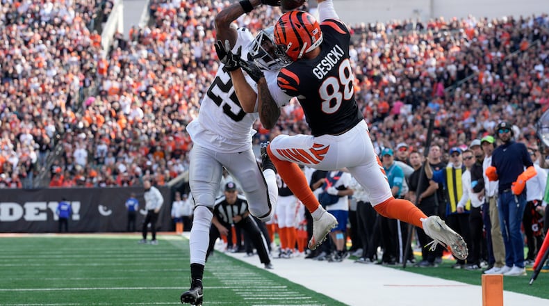Cincinnati Bengals tight end Mike Gesicki (88) cannot catch a pass in bounds while being defended by Las Vegas Raiders cornerback Decamerion Richardson during the first half of an NFL football game in Cincinnati, Sunday, Nov. 3, 2024. (AP Photo/Jeff Dean)