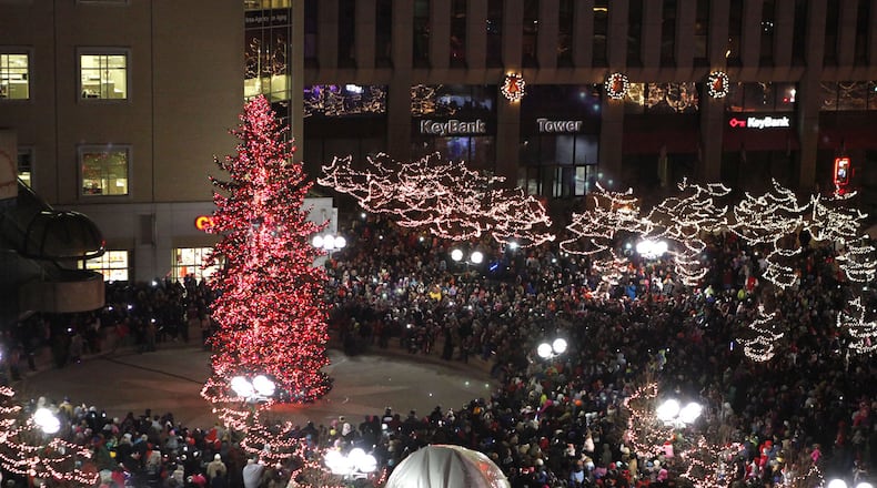 Pictured is the tree and crowd at the 2016 Annual Grande Illumination and Dayton Children’s Parade. TY GREENLEES/STAFF