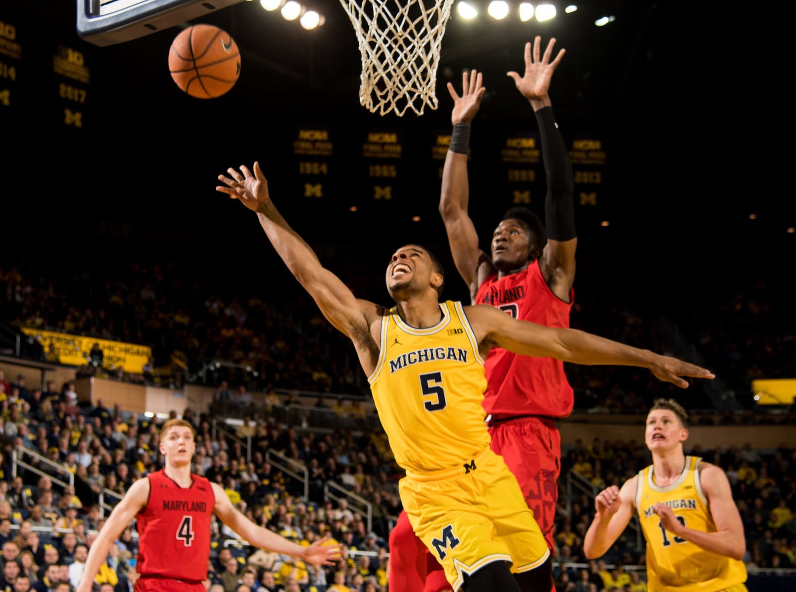 Alter High School grad Jaaron Simmons (5) was a backup guard for Michigan in the 2017-18 season that ended with an appearance in the NCAA national championship. MICHIGAN PHOTOGRAPHY