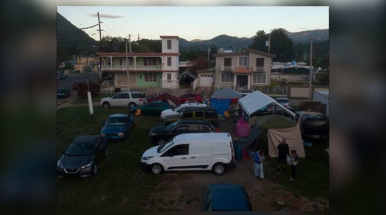 An Ohio National Guard unit is being deployed to Puerto Rico to help the people there in their continuing recovery from earthquakes in 2019. This photo shows  "Campamento Estrella 68," a family of residents in the town of Guayanilla on the southern coast, whose houses were damaged by an earthquake that forced them to sleep outdoors. Hundreds, if not thousands, of Puerto Ricans have been sleeping outside since a series of earthquakes began hitting the island Dec. 28, 2019. (Pedro Portal/Miami Herald/TNS)