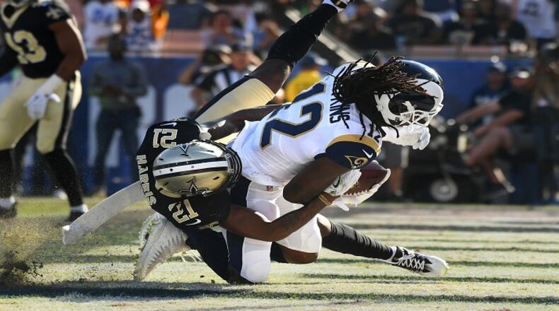 Los Angeles Rams receiver Sammy Watkins catches a touchdown pass as he is being tackled by New Orleans Saints cornerback De'Vante Harris in the first quarter on Sunday, Nov. 26, 2017 in Los Angeles, Calif. (Wally Skalij/Los Angeles Times/TNS)