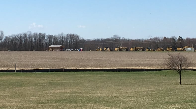 Heavy equipment will continue work on the rest of the Warren County Sports Park at Union Village, while archaeological digging is done at the site of two privies dating back two centuries. LAWRENCE BUDD/STAFF