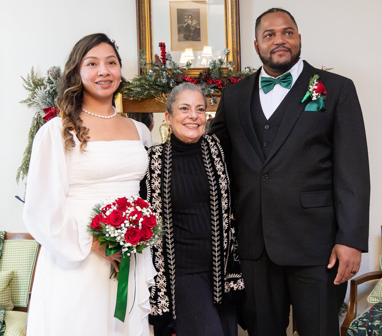 Dayton attorney Isabel Suarez (center) poses with Selena Huerta-Marquez (left) and Xavier Castillo after their wedding ceremony on Friday, Dec. 26 in Dayton. BRYANT BILLING/STAFF