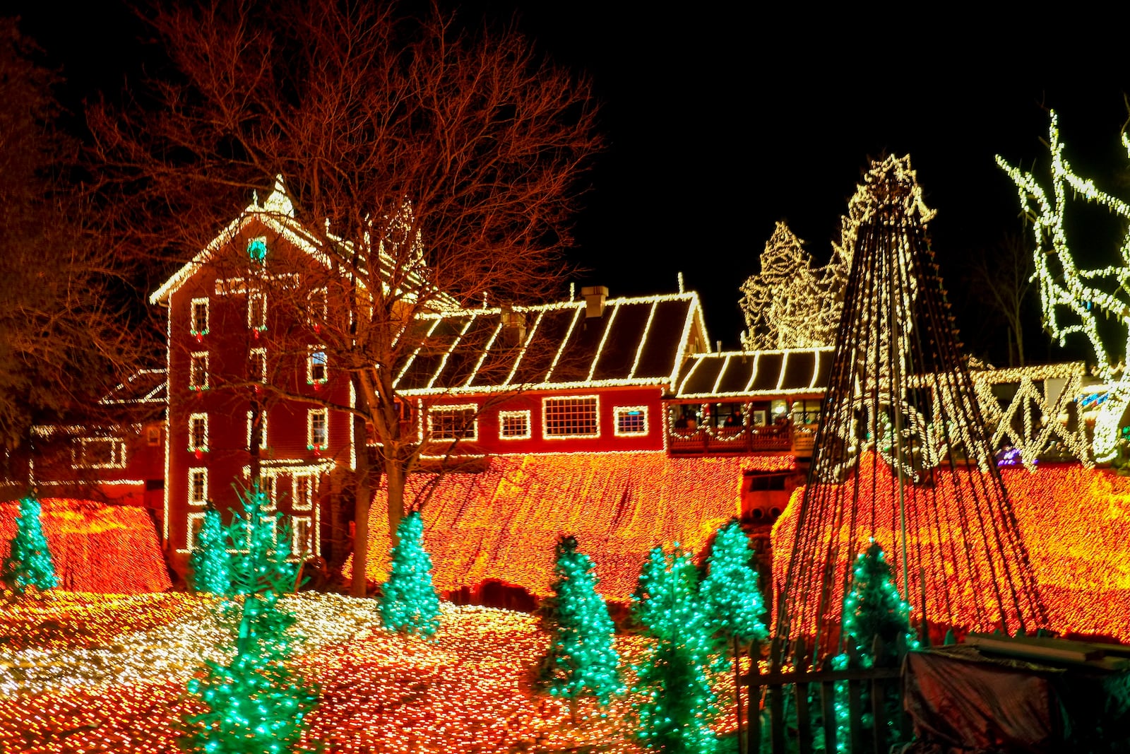 Visitors take in the Legendary Lights at the historic Clifton Mill, just outside Yellow Springs, Friday, Dec. 2, 2022. GREG LYNCH/STAFF