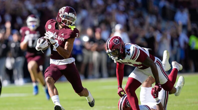 Texas A&M wide receiver Ashton Bethel-Roman (3) looks back at South Carolina defensive back Jalon Kilgore (24) after catching a pass for a first down during the second half of an NCAA college football game Saturday, Nov. 15, 2025, in College Station, Texas. (AP Photo/David J. Phillip)