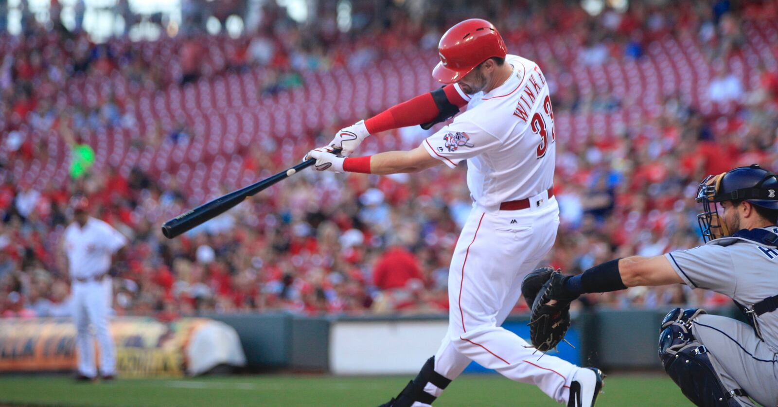 The Reds’ Jesse Winker singles against the Padres on Tuesday, Aug. 8, 2017, at Great American Ball Park in Cincinnati. David Jablonski/Staff