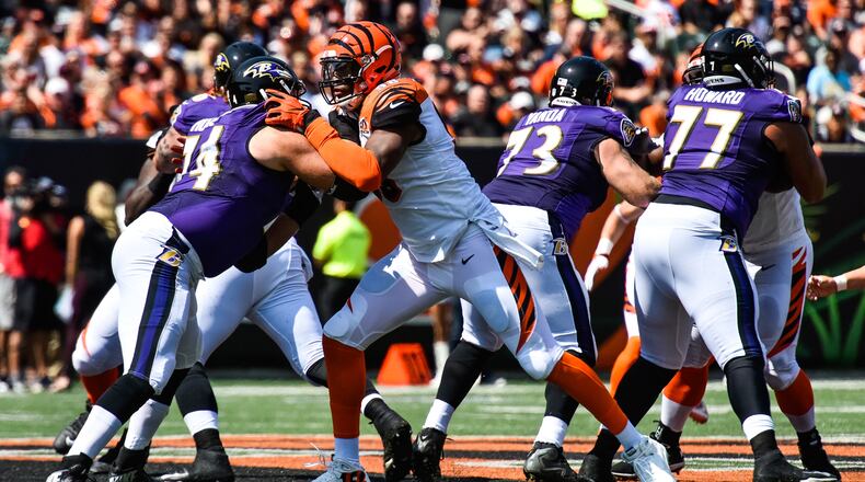 The Cincinnati Bengals defensive end Carlos Dunlap (96) matches up against Baltimore Ravens lineman James Hurst (74) during their 20-0 loss to the Baltimore Ravens Sunday, Sept. 10 at Paul Brown Stadium in Cincinnati. NICK GRAHAM/STAFF