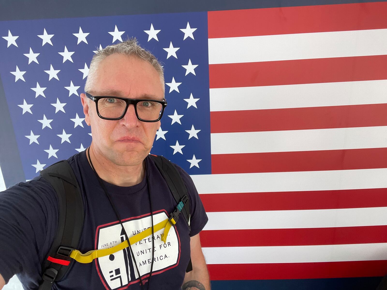 In this photo provided by Joe Plenzler, U.S. Marine Corps veteran Joe Plenzler poses in Washington, June 6, 2025, during the Unite For Veterans Coalition protest, which he helped organize. (Joe Plenzler, via AP)