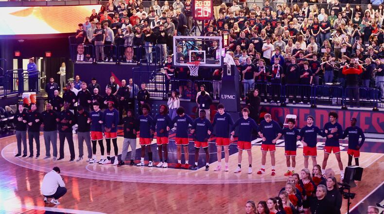Dayton stands for the national anthem before a game against Duquesne on Friday, Jan. 12, 2024, at the UPMC Cooper Fieldhouse in Pittsburgh. David Jablonski/Staff