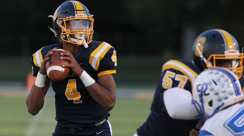 Springfield’s Raheim Moss throws a touchdown pass against Xenia on Friday, Sept. 28, 2018, at Evans Stadium in Springfield. David Jablonski/Staff