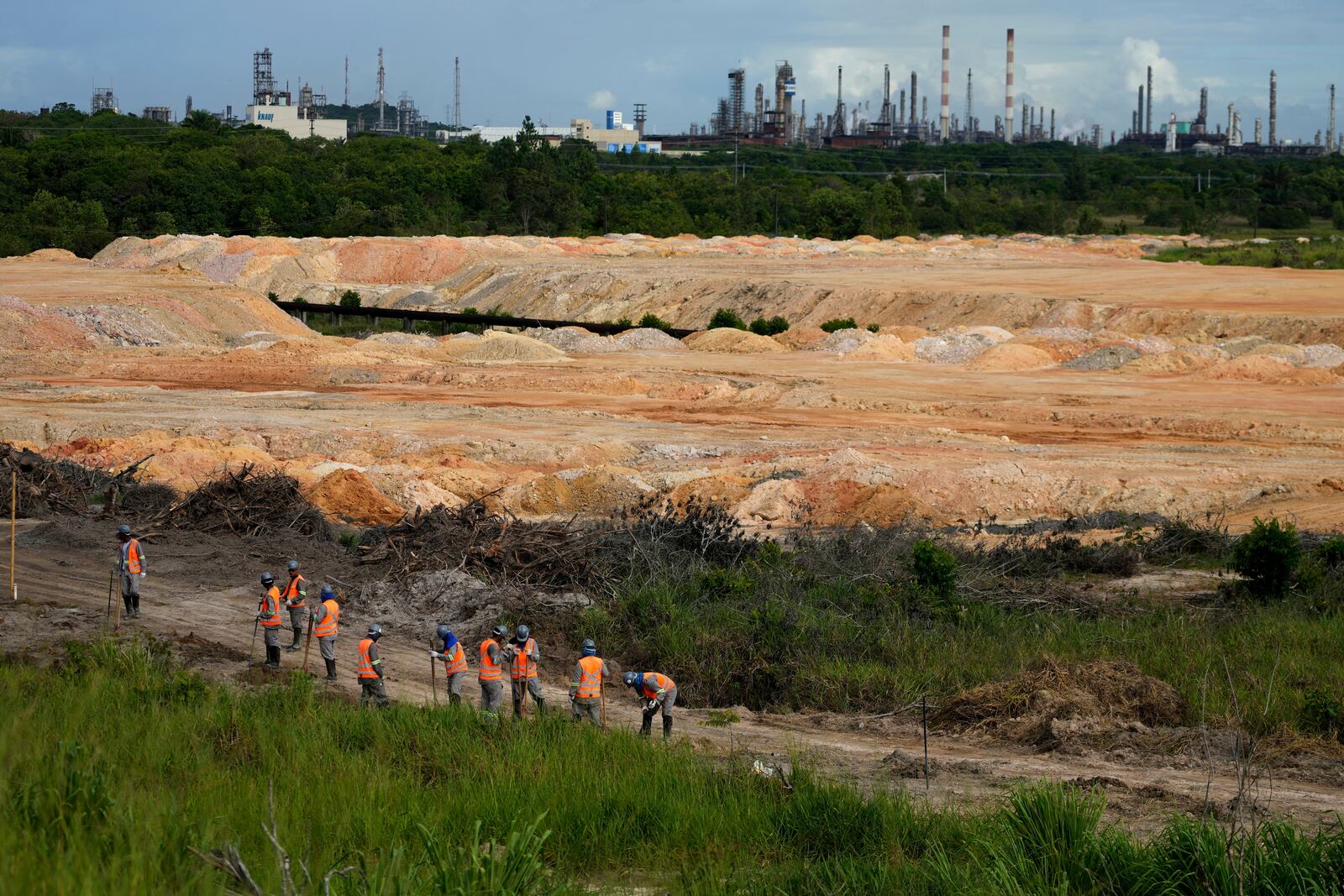 Employees work at a BYD vehicle factory under construction in Camacari, Bahia state, Brazil, Thursday, March 6, 2025. (AP Photo/Eraldo Peres)