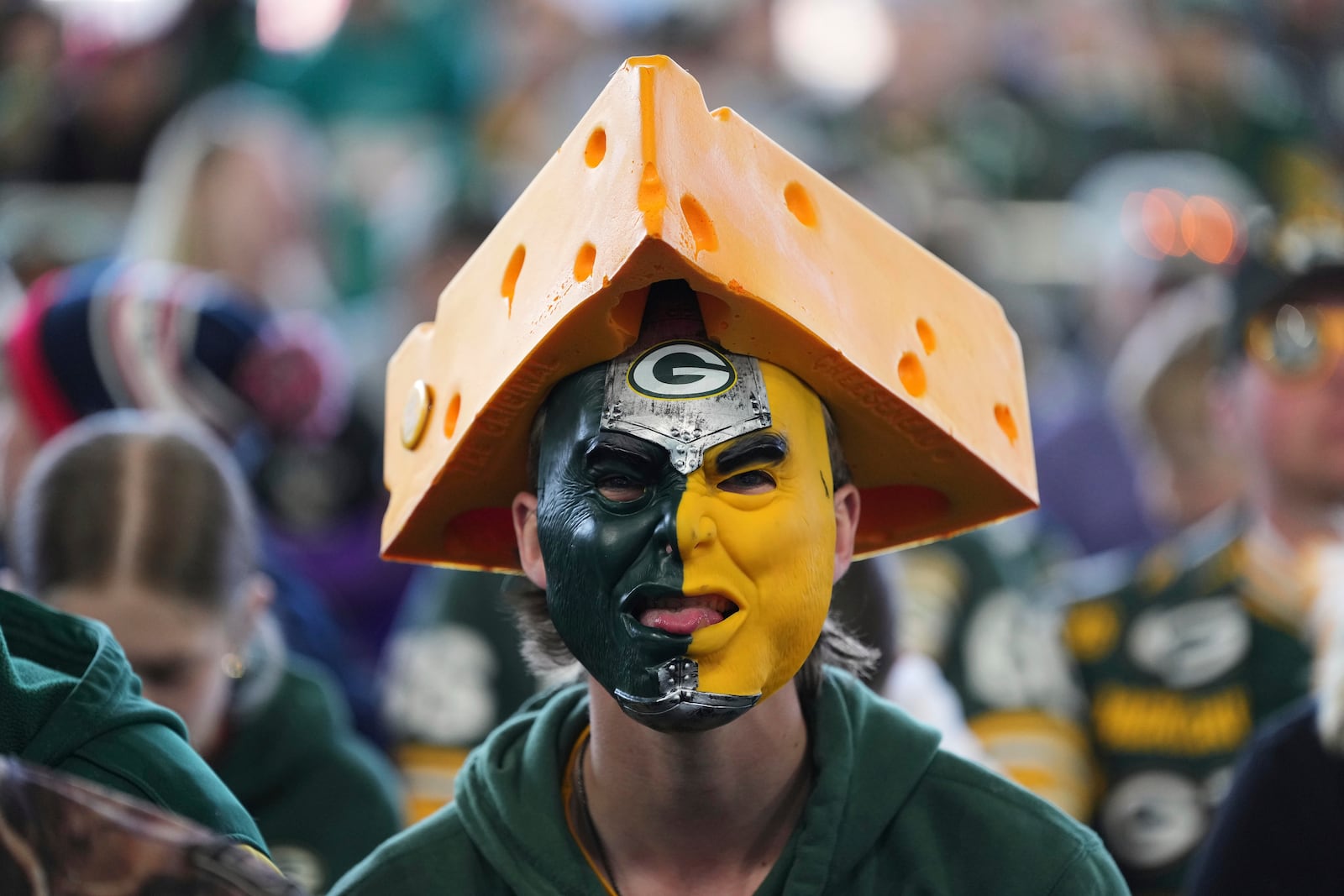 A Green Bay Packers fan watches during the third day of the NFL football draft, Saturday, April 26, 2025, in Green Bay, Wis. (AP Photo/Jeff Roberson)