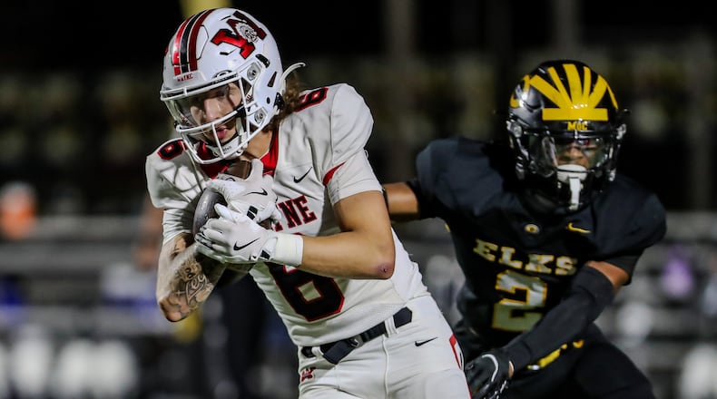 Wayne High School senior Gauge Miesse runs the ball during their game against Centerville on Friday night at Centerville Stadium. The Elks won 38-14. CONTRIBUTED PHOTO BY MICHAEL COOPER