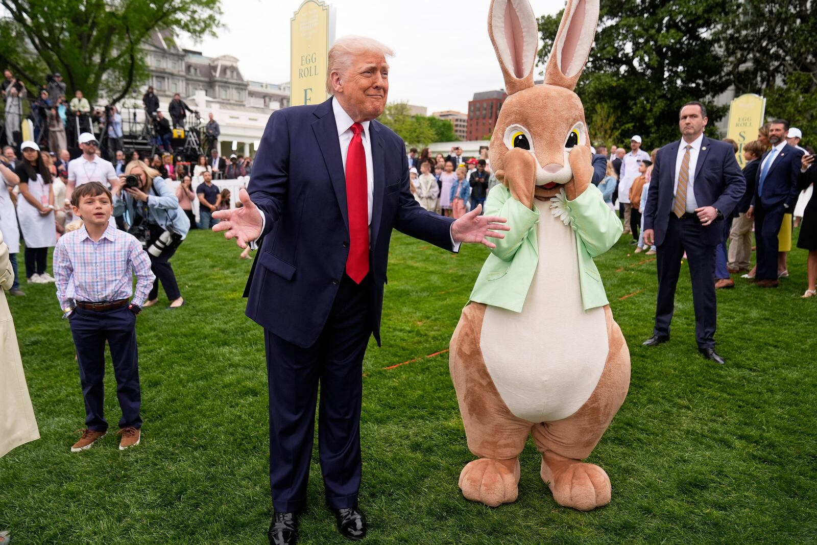 President Donald Trump stands with the Easter bunny as he participates in the White House Easter Egg Roll on the South Lawn of the White House, Monday, April 21, 2025, in Washington. (AP Photo/Mark Schiefelbein)