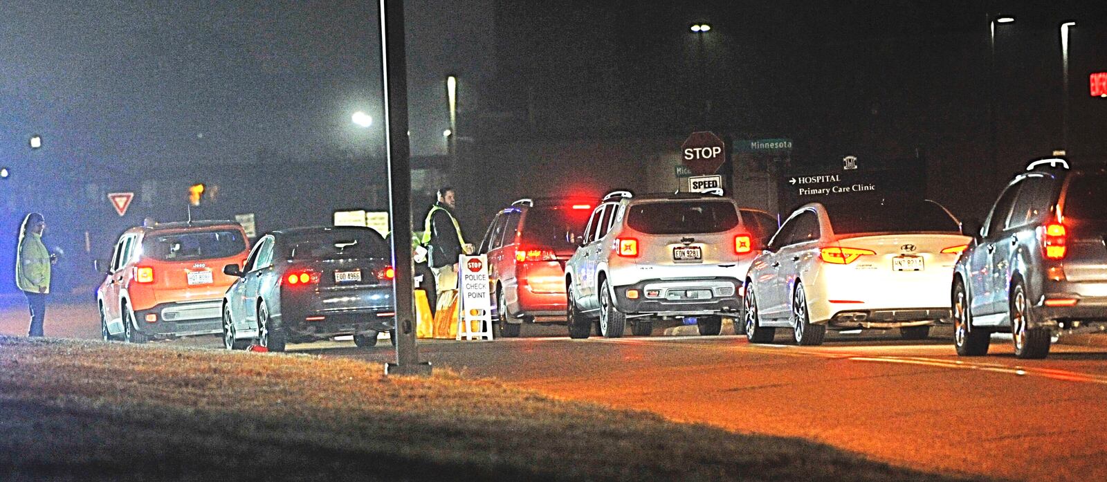 Vehicles lining up to enter the Dayton VA Medical Center campus Wednesday morning as security begins to screen with questions to drivers and passengers about possible exposure to coronavirus. MARSHALL GORBY/STAFF