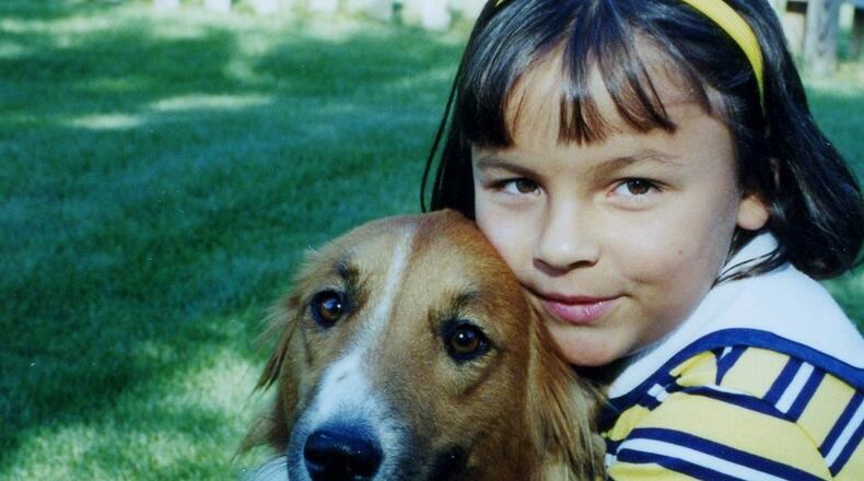 A younger Jordan with her dog, Lucy. KARIN SPICER
