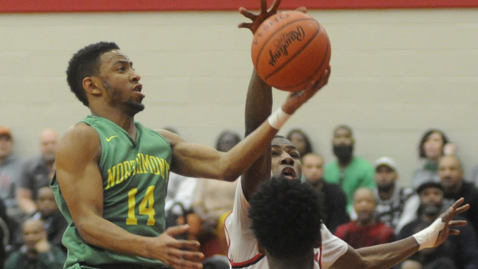 Northmont’s Arius Spears (with ball) has a shot blocked by Trotwood’s Carl Blanton. Trotwood-Madison defeated Northmont 98-76 in a boys high school basketball game on Saturday, Jan. 21, 2017. MARC PENDLETON / STAFF
