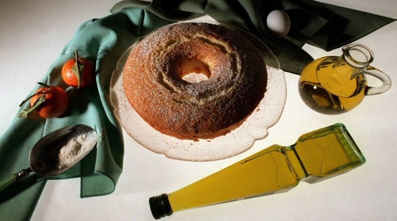 KRT FOOD STORY SLUGGED: OLIVEOIL KRT PHOTOGRAPH BY BARRY WONG/SEATTLE TIMES (KRT1-February 9) Orange Chiffon Cake is as refreshing as it is light, even with a half cup of olive oil in the batter. Prompted by the popularity of Mediterranean cuisine, many recipes for baked goods are substituting olive oil for butter or margarine. In addition to tasting good, olive oil seems to be good for your heart, or at least better than certain other fats like butter. (SE) AP, PL (jak41556) 1998 (COLOR) NO MAGS, NO SALES