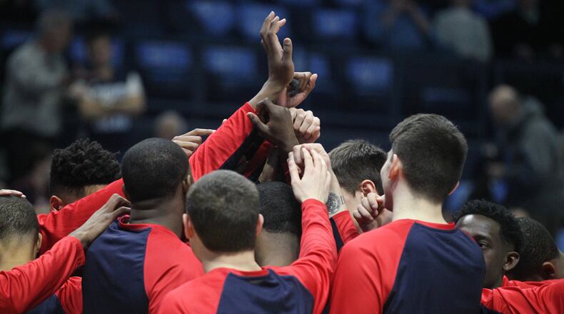 The Dayton Flyers huddle before a game at Rhode Island on Feb. 10, 2017, in Kingston, R.I.