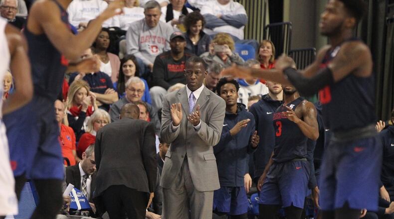 Dayton’s Anthony Grant claps after a basket in the first half against Saint Louis on Saturday, Jan. 27, 2018, at Chaifetz Arena in St. Louis, Mo. David Jablonski/Staff