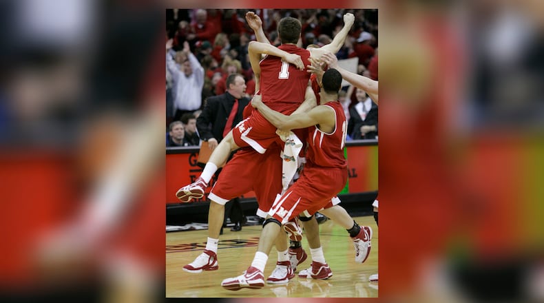 Miami's Doug Penno (1) is hoisted after banking home the game-winning 3-pointer in the second half of the Mid-American Conference men's basketball tournament championship game Saturday, March 10, 2007, in Cleveland. Miami defeated Akron 53-52 to advance to the NCAA Tournament. (AP Photo/Tony Dejak)