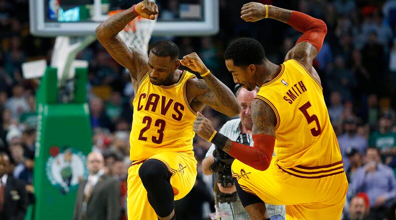 FILE - In this Dec. 15, 2015, file photo, Cleveland Cavaliers’ LeBron James and J.R. Smith (5) dance before an NBA basketball game against the Boston Celtics in Boston. James stepped into free agent J.R. Smith’s contract situation Friday, Sept. 30, 2016, and said the Cavs need to sign the shooting guard. Smith had a major role in the Cavs winning an NBA title last season and James feels he’s earned a new deal. Smith made $5 million last season. (AP Photo/Winslow Townson, File)