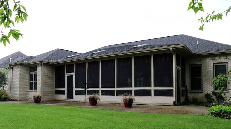 The screen-enclosed porch has 3 ceiling fans, 3 skylights and is accessible from 4 different parts of the house, including the main bedroom suite, a full bathroom, the breakfast room and the family room.