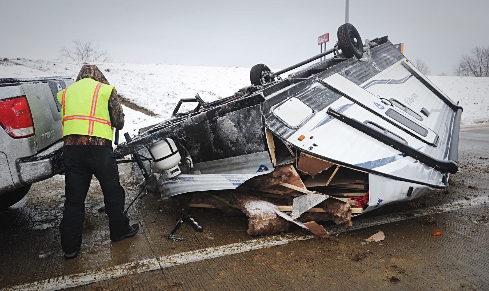 I-70 west ramp closes after trailer rolls over due to slick roads
