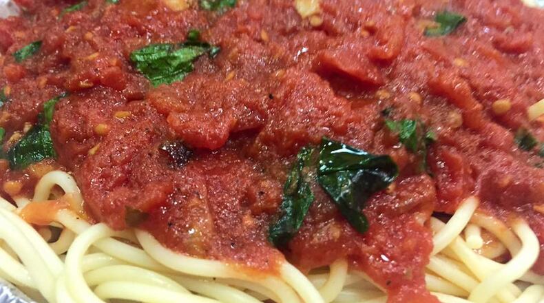 Tuscany's Grill & Market in Centerville is giving away free ham and spaghetti dinners to those in need this holiday season.