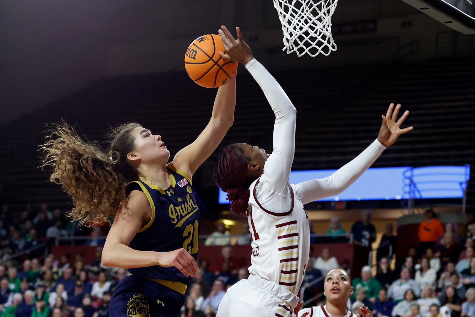 Notre Dame forward Maddy Westbeld, left, blocks a shot by Boston College guard Andrea Daley, right, during the second half of an NCAA college basketball game, Thursday, Jan. 23, 2025, in Boston. (AP Photo/Mary Schwalm)