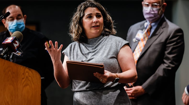 Sarah Hackenbracht, President CEO of the Greater Area Hospital Association, talks to the media about COVID-19 in the Miami Valley. JIM NOELKER/STAFF