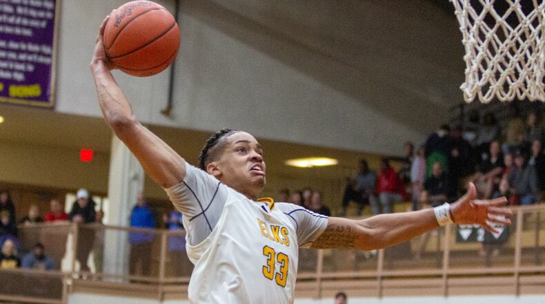 Centerville's Jonathan Powell goes in for a dunk off a steal to give the Elks an 11-point lead late in Saturday's Division I sectional final at Butler High School. Jeff Gilbert/CONTRIBUTED