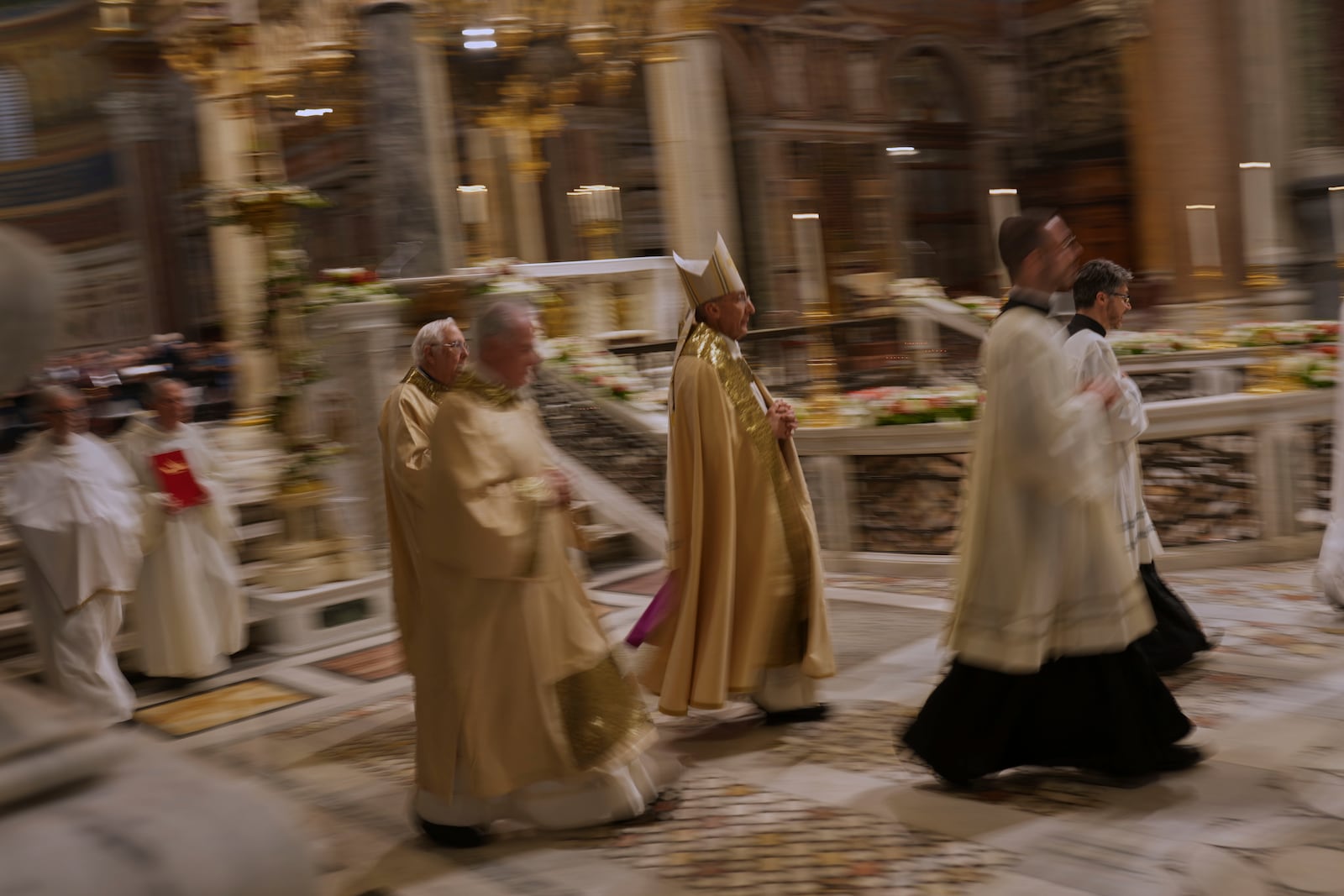 Cardinal Baldassare Reina, center, leads a prayer for Pope Francis, at the St. John Lateran Basilica in Rome, Thursday, April 24, 2025. (AP Photo/Francisco Seco)