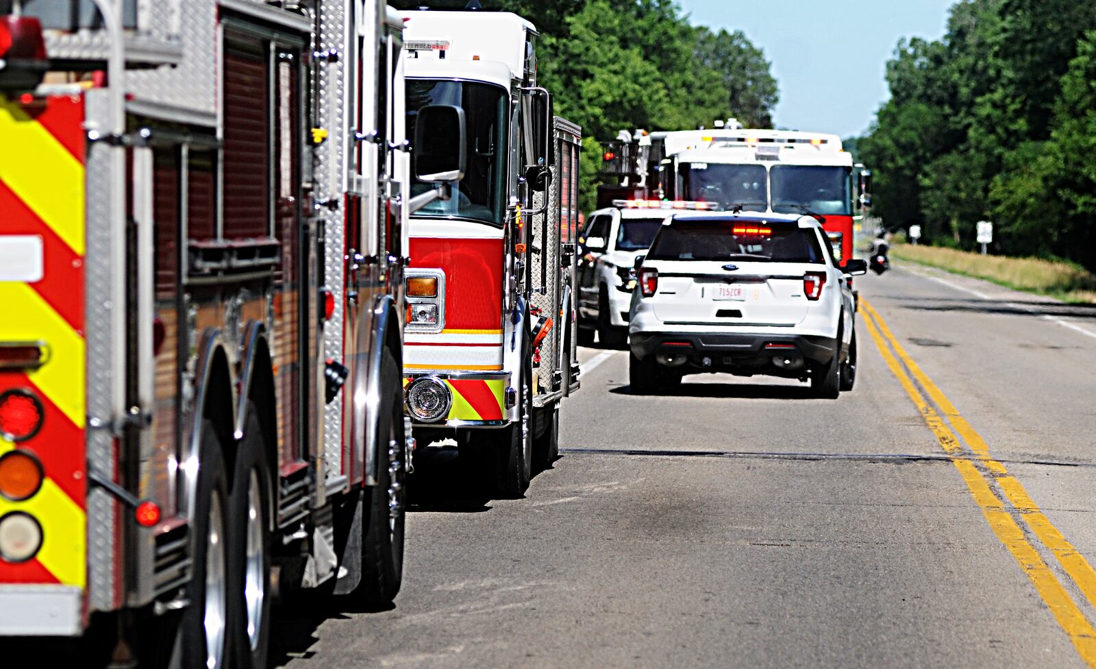 Rescue units from several area jurisdictions responded to the Mad River on Thursday, June 14, 2018, for three people who became stranded when they were separated from their recreational inner tubes. (Marshall Gorby/Staff)