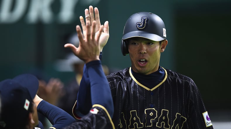 Outfielder Shogo Akiyama celebrates after scoring a run after the single by Yoshitomo Tsutsugoh in the top of the sixth inning during the SAMURAI JAPAN Send-off Friendly Match between CPBL Selected Team and Japan at the Yafuoku Dome on March 1, 2017 in Fukuoka, Japan. (Photo by Matt Roberts/Getty Images)