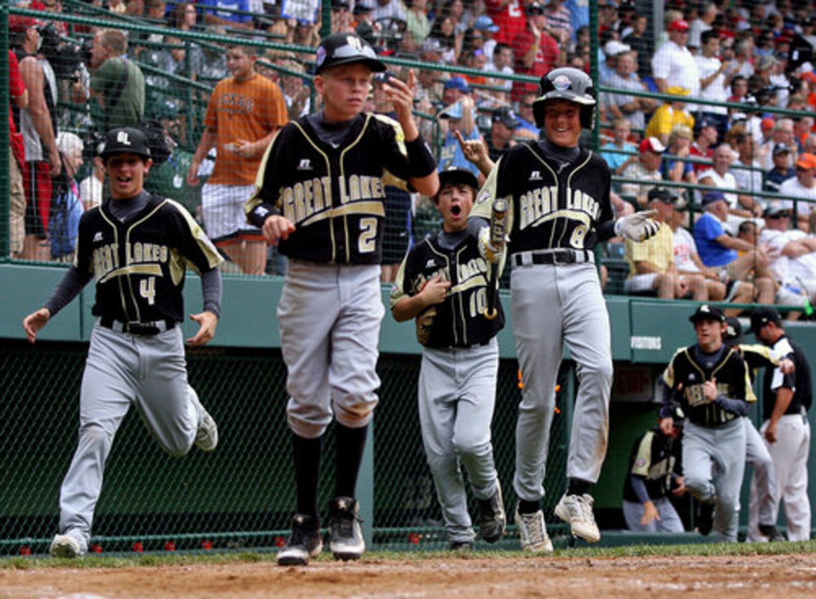 Hamilton West Side clears the bench to celebrate Jake Jones' second home run in the fourth-inning of Saturday's game against Toms River, N.J., at Howard J. Lamade Stadium in South Williamsport, PA.