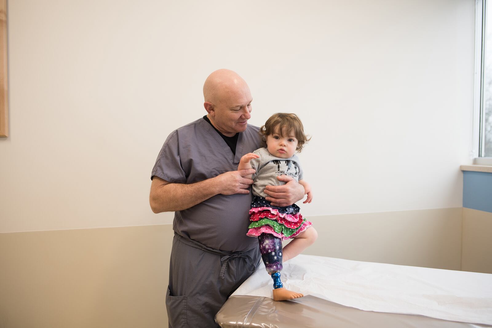 Albert with Gwendolyn Carroll, who was born missing the tibia in her right leg