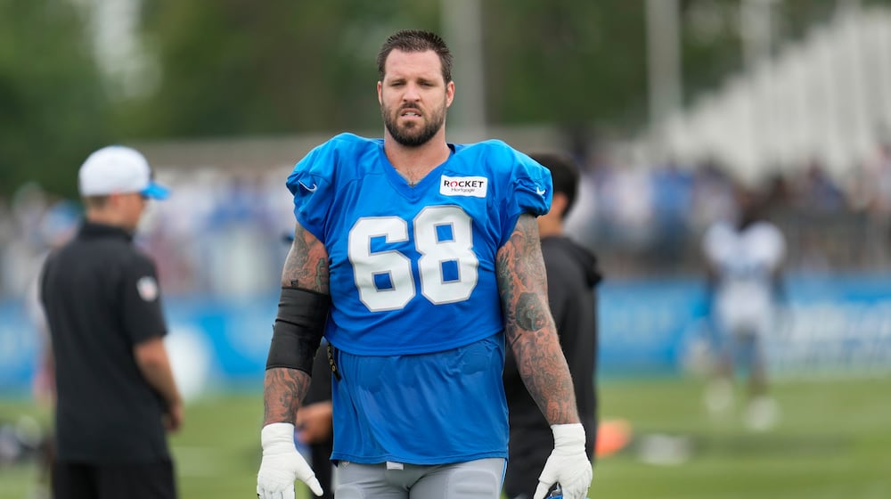 Detroit Lions offensive tackle Taylor Decker walks off the field after an NFL football practice in Allen Park, Mich., Monday, July 29, 2024. (AP Photo/Paul Sancya)