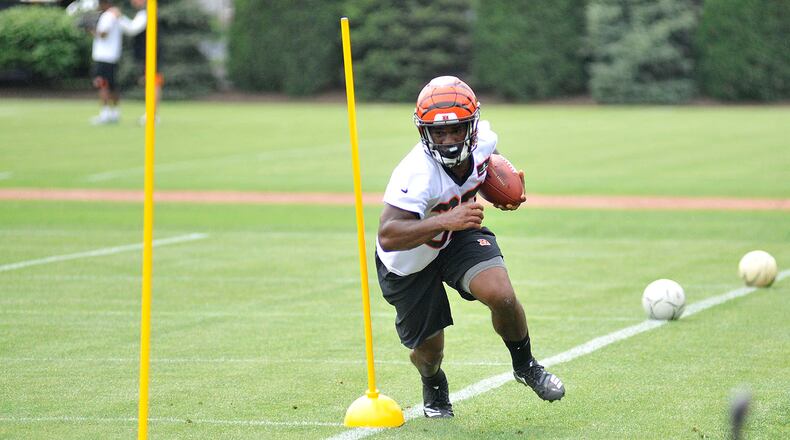 Cincinnati Bengals running back Mark Walton goes through a drill during rookie camp Saturday at Paul Brown Stadium. JAY MORRISON/STAFF