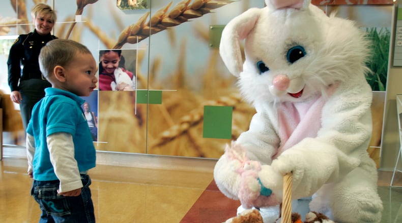 Jaiden Bush, 1, received and early visit from the Easter Bunny Thursday, April 1, 2010 at the Children's Hospital Liberty Campus in Liberty Township, Butler County, Ohio. Sheriff's deputies helped the large bunny passed-out 75 stuffed bunny rabbits as well as other goodies from the Sheriff's department. The visit was funded by the international organization The Easter Bunny Foundation. Staff photo by Gary Stelzer