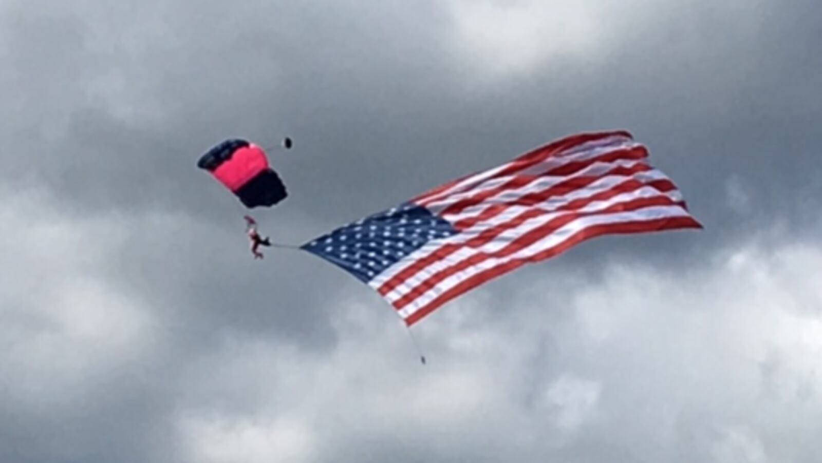 Misty Blues parachutist opens Dayton Air Show. BARRIE BARBER/STAFF