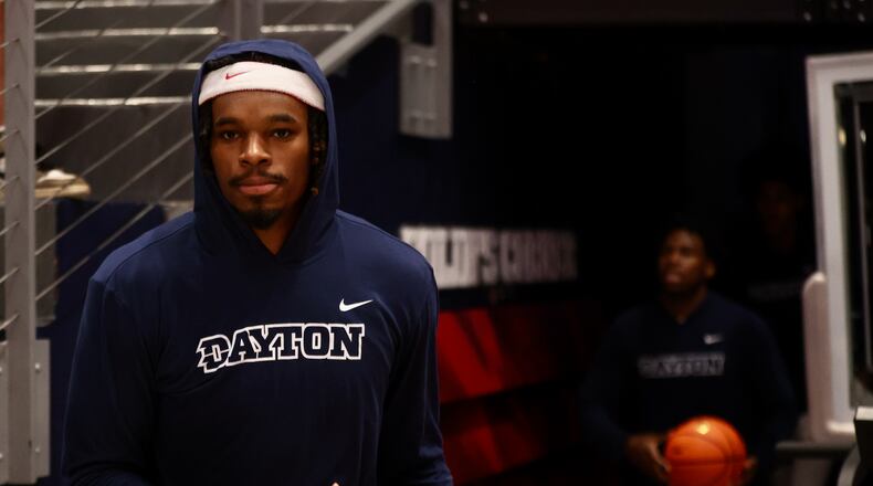 Dayton's DaRon Holmes II leads the team onto the court before a game against Cedarville in an exhibition game on Saturday, Oct. 28, 2023, at UD Arena. David Jablonski/Staff