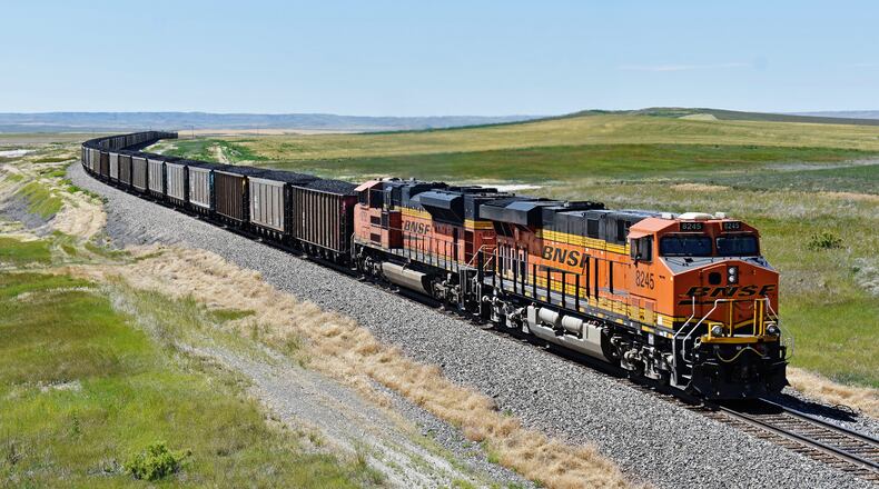 A BNSF railroad train hauling carloads of coal from the Powder River Basin of Montana and Wyoming is seen east of Hardin, Mont., July 15, 2020. (AP Photo/Matthew Brown, File)