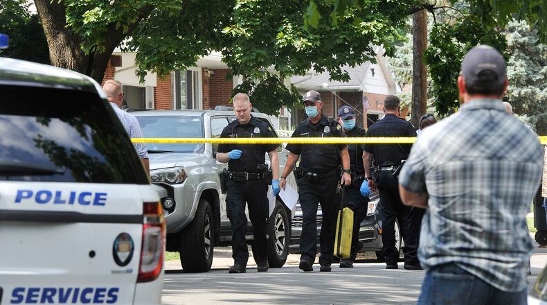 Police responded to the intersection of West Hillcrest Avenue and Mayfair Road in Dayton shortly before 2 p.m. Monday after a caller reported a man had been shot in a black car. MARSHALL GORBY/STAFF