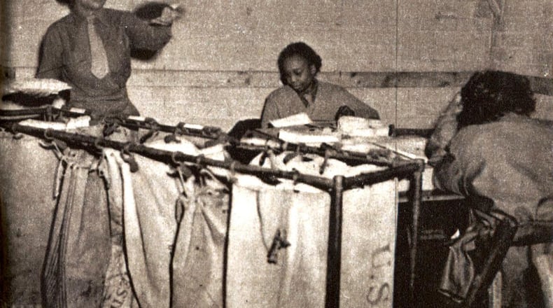 FILE - In this image provided by courtesy of the National Archives, members of the 6888th Central Postal Directory Battalion, an all-female, all-Black unit formed during World War II, sort mail in an undated Department of Defense photo. Surviving members are being recognized following President Joe Biden's decision to sign a bill authorizing the Congressional Gold Medal for the unit. (Courtesy of National Archives via AP, File)